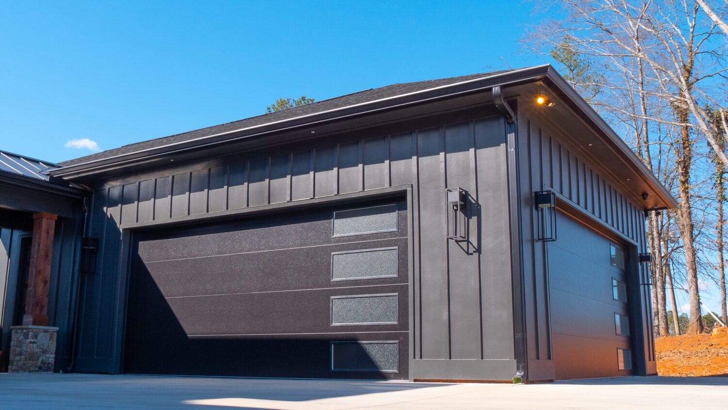 Planks Faux Wood Garage Door on Black Contemporary Exterior